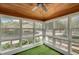 Bright sunroom with multiple windows providing ample natural light and a peaceful view of the yard at 813 Sandy Creek Rd, Fayetteville, GA 30214