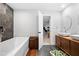 This primary bathroom features a soaking tub, dual sinks, and modern finishes at 2870 Pharr Ct # 3002, Atlanta, GA 30305