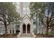 Elegant building entrance with mature trees, accessible ramps and staircase leading to doors at 2870 Pharr Ct # 3002, Atlanta, GA 30305