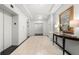 Elegant lobby hallway with tiled flooring, a console table, and elevator access at 2870 Pharr Ct # 3002, Atlanta, GA 30305