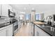 Bright open kitchen with stainless steel appliances, dining area, and views at 2870 Pharr Ct # 3002, Atlanta, GA 30305