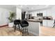 Stylish kitchen featuring white cabinetry, stainless steel appliances, and a bar top with seating at 2870 Pharr Ct # 3002, Atlanta, GA 30305