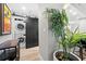 Convenient laundry area with stacked washer and dryer, and sliding barn door at 2870 Pharr Ct # 3002, Atlanta, GA 30305