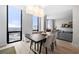 This open floor plan features a dining room, a living room, floor-to-ceiling windows, and hardwood floors at 2870 Pharr Ct # 3002, Atlanta, GA 30305