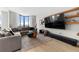 Comfortable living room with large sectional sofa, area rug, and media center at 2870 Pharr Ct # 3002, Atlanta, GA 30305