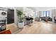 Open living space with laundry, kitchen, breakfast bar, and living room with large windows at 2870 Pharr Ct # 3002, Atlanta, GA 30305