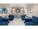 Inviting lobby area with comfortable blue seating, mirrored accents, and elegant decor at 2870 Pharr Ct # 3002, Atlanta, GA 30305