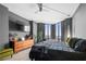 This primary bedroom suite features floor-to-ceiling windows and hardwood floors at 2870 Pharr Ct # 3002, Atlanta, GA 30305