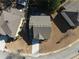 Aerial view shows house roof, driveway, and surrounding neighborhood at 6545 Muirfield Pt, Fairburn, GA 30213