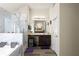 Bright primary bathroom boasts soaking tub, walk-in shower, and vanity with ample storage at 6545 Muirfield Pt, Fairburn, GA 30213