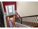 Elegant entryway with hardwood floors, staircase, and front door with sidelights at 6545 Muirfield Pt, Fairburn, GA 30213