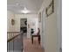 Upstairs hallway with multiple rooms and views of the home's interior at 6545 Muirfield Pt, Fairburn, GA 30213