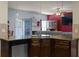 View of a kitchen with stainless appliances, granite countertops, and seamless flow into the living space at 6545 Muirfield Pt, Fairburn, GA 30213