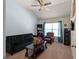 Inviting living room featuring neutral walls, carpeted floor, and plenty of seating at 6545 Muirfield Pt, Fairburn, GA 30213