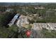 Aerial view of the community showcasing the layout of the townhomes and surrounding trees at 145 Sunset Ln, Woodstock, GA 30189