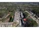 Community aerial view showcasing rooflines, driveways, and the surrounding landscape at 145 Sunset Ln, Woodstock, GA 30189