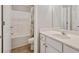 Bathroom featuring vanity with white cabinets, single sink, toilet, and shower with tub at 145 Sunset Ln, Woodstock, GA 30189