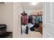 Walk in closet with shelving and clothes hanging, laundry basket and storage at 145 Sunset Ln, Woodstock, GA 30189