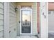 Inviting front door with glass panels and decorative hardware, leading into a well-maintained home at 145 Sunset Ln, Woodstock, GA 30189