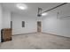 Attached garage with bright lighting and plenty of room for parking and storage at 145 Sunset Ln, Woodstock, GA 30189