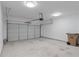 Spacious two-car garage with clean concrete floor, overhead lighting and an automatic door opener at 145 Sunset Ln, Woodstock, GA 30189