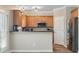 Bright kitchen featuring wood cabinets and stainless-steel appliances at 145 Sunset Ln, Woodstock, GA 30189