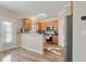 Eat-in kitchen with stainless steel appliances and a breakfast bar at 145 Sunset Ln, Woodstock, GA 30189