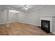 Bright living room features a cozy fireplace and hardwood floors at 145 Sunset Ln, Woodstock, GA 30189