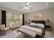 Bedroom with tray ceilings and plenty of natural light at 145 Sunset Ln, Woodstock, GA 30189