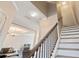 Staircase features wood and wrought iron details at 145 Sunset Ln, Woodstock, GA 30189