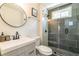 Updated bathroom featuring a glass enclosed shower with gray tiling and a modern vanity at 299 Fletcher Street Sw, Atlanta, GA 30315