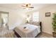 Cozy bedroom featuring a ceiling fan, gray bedding, neutral walls and luxury vinyl plank flooring at 299 Fletcher Street Sw, Atlanta, GA 30315