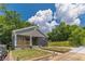 Charming bungalow with gray siding, black brick accents, front porch, and well maintained lawn at 299 Fletcher Street Sw, Atlanta, GA 30315