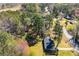 Aerial view of home featuring the neighborhood, surrounding trees, and street at 5042 Central Church Rd, Douglasville, GA 30135