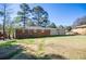 Spacious backyard featuring brick home and lush lawn at 5042 Central Church Rd, Douglasville, GA 30135