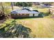 Aerial shot of a large grassy backyard, home exterior, and partial fence at 5042 Central Church Rd, Douglasville, GA 30135