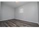 Bedroom featuring hardwood floors and a bright window at 5042 Central Church Rd, Douglasville, GA 30135