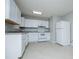 The kitchen features white appliances and ample counter space at 5042 Central Church Rd, Douglasville, GA 30135