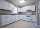 The kitchen is equipped with stainless steel appliances and modern fixtures at 5042 Central Church Rd, Douglasville, GA 30135