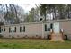 Charming single-story home with neutral siding, black shutters, and a welcoming front entrance at 17 Wildflower Cv, Carrollton, GA 30116