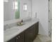 Elegant bathroom with double sinks, dark wood cabinets, and marble countertops at 81 Delmont Ne Dr, Atlanta, GA 30305