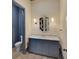 Bathroom featuring a stylish vanity with marble countertop and decorative wall lighting at 81 Delmont Ne Dr, Atlanta, GA 30305