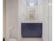 Bathroom with a blue vanity cabinet and marble countertop, offering a modern touch at 81 Delmont Ne Dr, Atlanta, GA 30305
