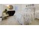 Charming bedroom with floral bedding, a unique mirror, and a cozy chair at 81 Delmont Ne Dr, Atlanta, GA 30305