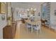 Elegant dining room featuring a chandelier and access to the modern kitchen at 81 Delmont Ne Dr, Atlanta, GA 30305