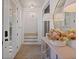 Bright foyer with herringbone floors, white trim, and a decorative console table with a large mirror at 81 Delmont Ne Dr, Atlanta, GA 30305