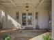 Charming front door with sidelights and a decorative pendant light for a warm welcome at 81 Delmont Ne Dr, Atlanta, GA 30305