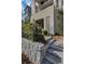 Inviting front entrance with stone steps, a wrought-iron fence, and manicured landscaping at 81 Delmont Ne Dr, Atlanta, GA 30305