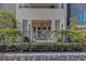 Inviting front porch with stylish decor, decorative lattice, and wrought iron fencing at 81 Delmont Ne Dr, Atlanta, GA 30305