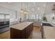Spacious kitchen featuring a large island with seating and modern stainless steel appliances at 81 Delmont Ne Dr, Atlanta, GA 30305